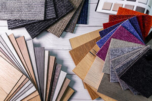 looring and furniture materials - colorful floor carpet and wooden laminate samples